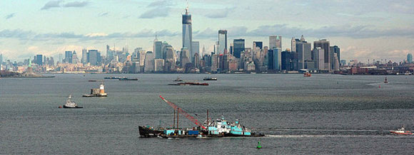 John B. Caddell with tug and crane barge assist on her way to repair yard. Photo: Staten Island Advance