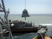 Stack of USS Guardian hoisted by crane ship. Photo:PCG 