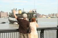 Well-wishers bid farewell to the Yankee Ferry as it's tugged from Pier 12 toward Red Hook, Brookyln   Photo: Hoboken Patch